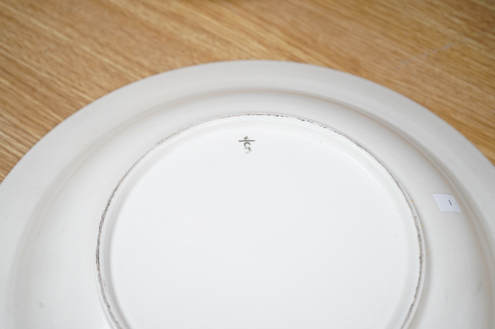 Olive Bourne for Poole pottery ‘sugar for the birds’, a large dish, stamped to the base, 38cm in diameter